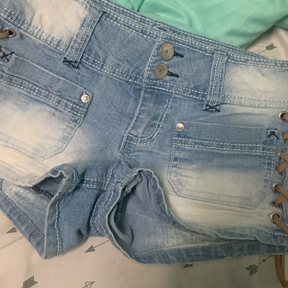 Acid washed shorts. Lace on the sides. Size 1.